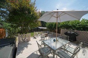 Fenced in Back Yard and deck with grill, firepit, hot tub.
