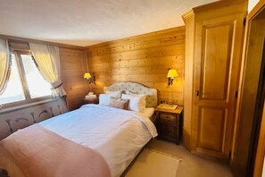 the cozy bedroom with a double bed 