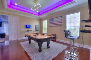 A vibrant space featuring a pool table for your entertainment.