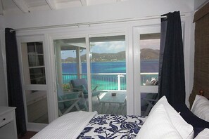 Both bedrooms have outstanding views of green mountains plunging a colorful Caribbean Sea