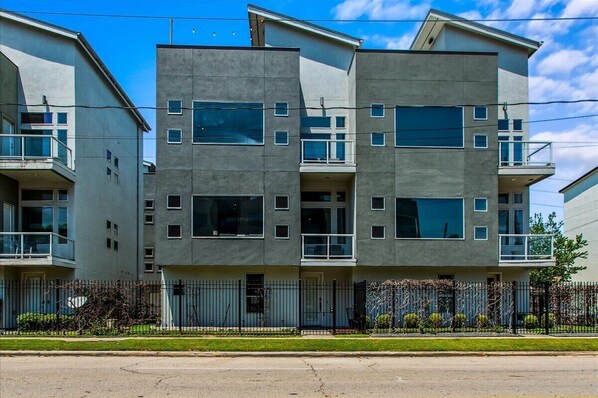 Modern architecture with sleek lines and inviting balconies!