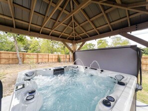 Dive into relaxation mode in our luxurious hot tub!  With built-in Bluetooth speakers, a soothing waterfall, and ambient lighting, your stay with us is about unwinding and making memories.