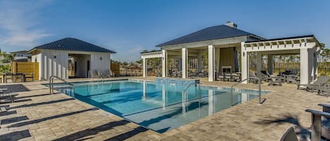 Spacious community pool with shallow ends and waterfall -- adjacent to the Bay, pickleball, bocce, and life-size chess and checkers