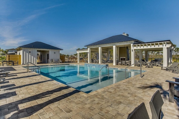 Spacious community pool with shallow ends and waterfall -- adjacent to the Bay, pickleball, bocce, and life-size chess and checkers