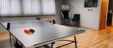 Ping pong table with an abundance of paddles and balls. Shoot some hoops or try for a bullseye on the electronic dart board. 