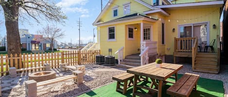 Shared backyard with picnic table and fire pit