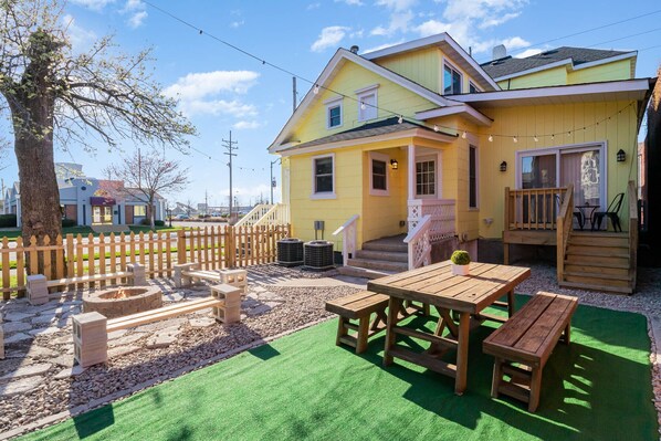 Shared backyard with picnic table and fire pit