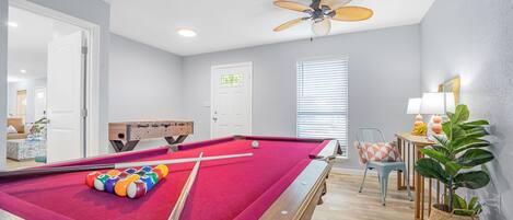 Game room with pool table and foosball and work station . Board games available 