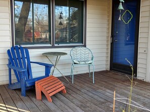 Relax on the front porch and enjoy the raised container garden. Depending on the time of year, it may include asparagus, parsley, cilantro, basil and greens.