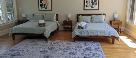 Massive single room with two new queen sized beds/bed frames! Enjoy the natural sun coming in from all parts of the day with beautiful views of nature in the front and back yards.