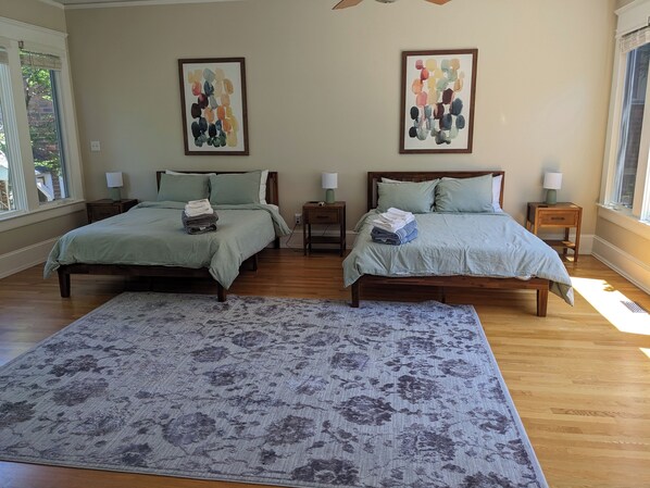 Massive single room with two new queen sized beds/bed frames! Enjoy the natural sun coming in from all parts of the day with beautiful views of nature in the front and back yards.