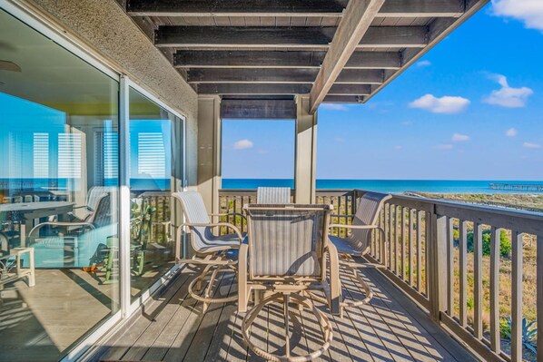 Balcony with amazing view of ocean with seating for 4.