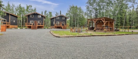 Overview of cabins + outdoor kitchen area.