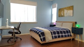 Primary bedroom with office desk and ergonomic chair