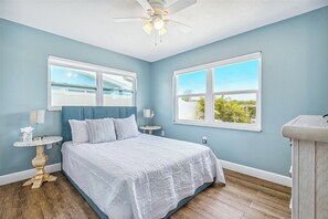 Cozy and inviting guest bedroom featuring a plush queen bed for a restful stay!
