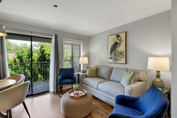 Living Room - Newly painted costal-vibe villa with new furniture and lots of natural light.