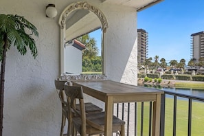 Dine al fresco on the balcony overlooking the first hole on the par 3 course. 