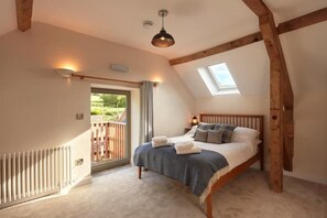 Comfy en suite bedrooms with original exposed beams