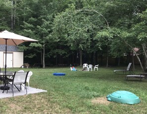 Small sandbox and wading pool for fun activities.