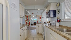 The kitchen is open to the dining room