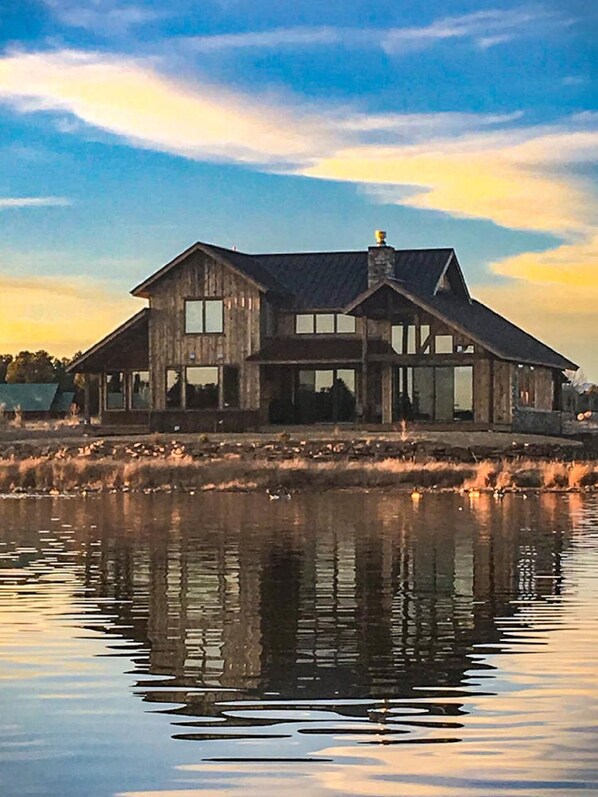 View of our property from paddle boarding on the lake.