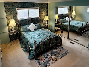 Grand master suite with a romantic under-vibe, powder room adjacent, & shower.