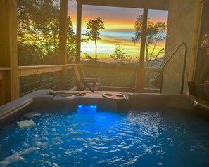 Indulge in a hot tub soak, while drinking in magnificent sunset views of the mountains, on a fully private deck!