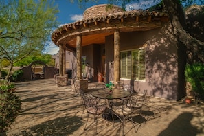 Covered patio with seating to enjoy morning coffee or a cocktail for sunsets.