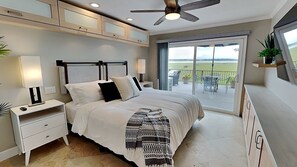 Master bedroom opens up to a captivating patio deck view.