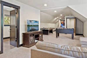 35. Game room with foosball and air hockey table  