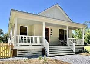 Spacious front porch with 2 rocking chairs and table for 4.