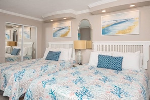 Double the Comfort: Enjoy two queen beds with fresh linens, perfect for a restful night's sleep after a day of sun and sand.