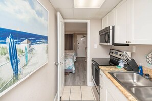 This fully stocked kitchen has everything you need to prepare meals, with stainless steel appliances and granite countertops.