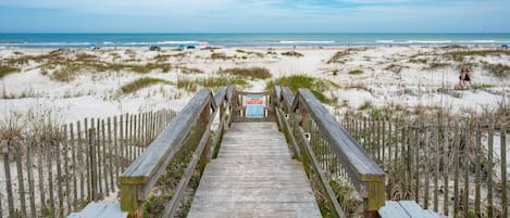 The quaint beachside neighborhood features a private boardwalk over the dunes.