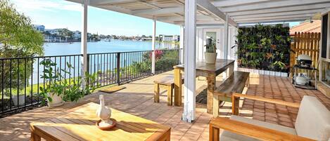 Outdoor lounge, dining, BBQ on absolute waterfront This is Sunshine Coast living at its best