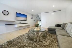 Spacious lounge room, with smart TV