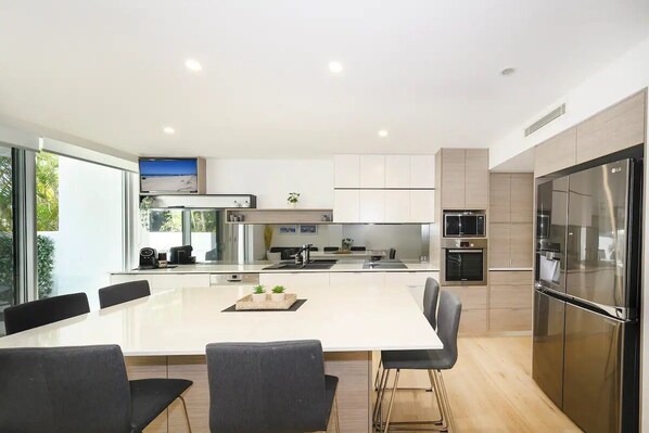 Stunning, newly renovated beachfront townhouse. Spacious modern kitchen and dining