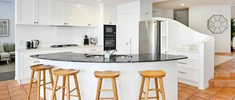 Kitchen, dining room, with lounge room beyond