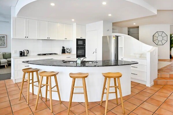 Kitchen, dining room, with lounge room beyond