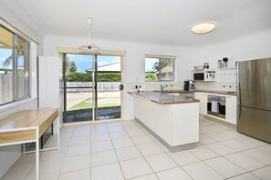 Dining room looking towards kitchen and back yard