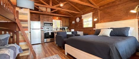 Cozy cedar cabin with exposed natural beams.