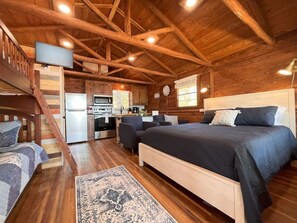 Cozy cedar cabin with exposed natural beams.