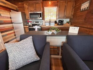 Kitchen with dining table and stools