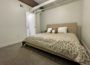 King bed with laundry and walk in closet attached