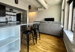 Living room space and open kitchen floor plan