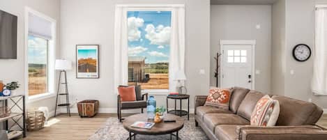 Beautiful, airy living room w/smart tv
