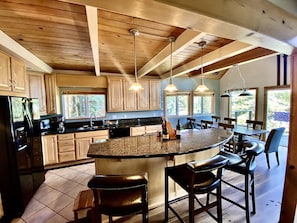 Fully stocked Kitchen and bar seating