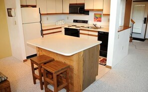 Indoors, Kitchen, Kitchen Island, Refrigerator, Rug