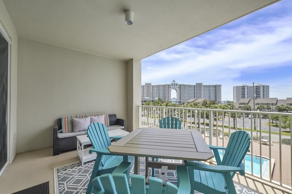 Enjoy beautiful views of the pool from the large, covered patio