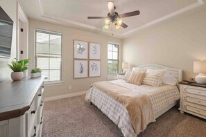 The guest bedroom with a queen bed, large nightstands and charging stations.